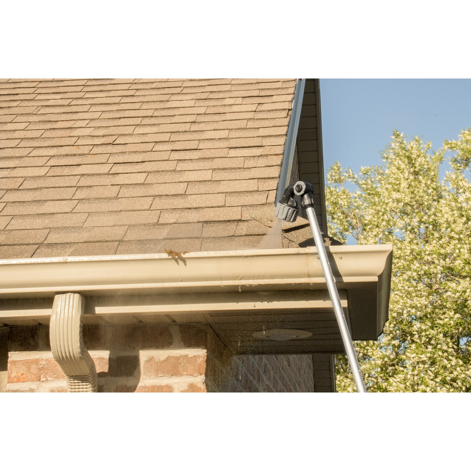 X-Stream 72in Telescoping Watering Wand with 4-pattern nozzle, gray finish spraying water on Tampa Home & Garden Store