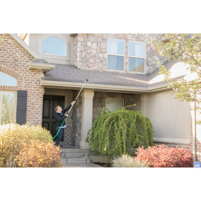 X-Stream 72in Telescoping 4-Pattern Watering Wand by Orbit Irrigation in use on brick/stone home exterior with green hose on Tampa Home & Garden Store
