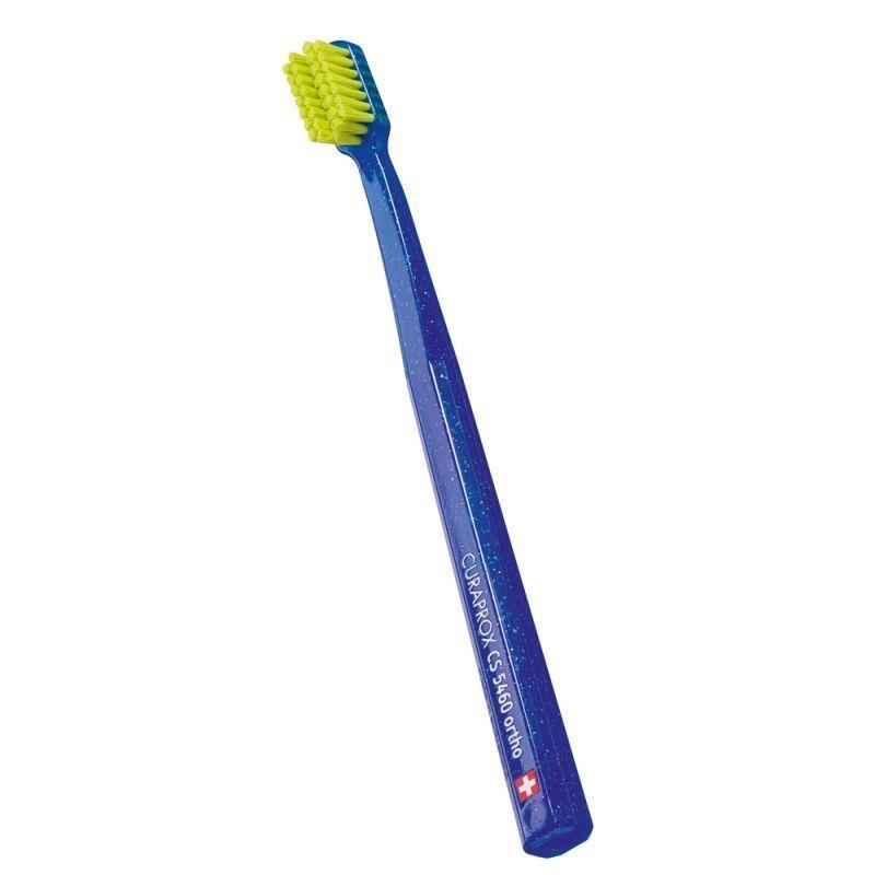 Curaprox CS 5460 orthodontic toothbrush with blue handle and lime green bristles on Tampa Home & Garden Store