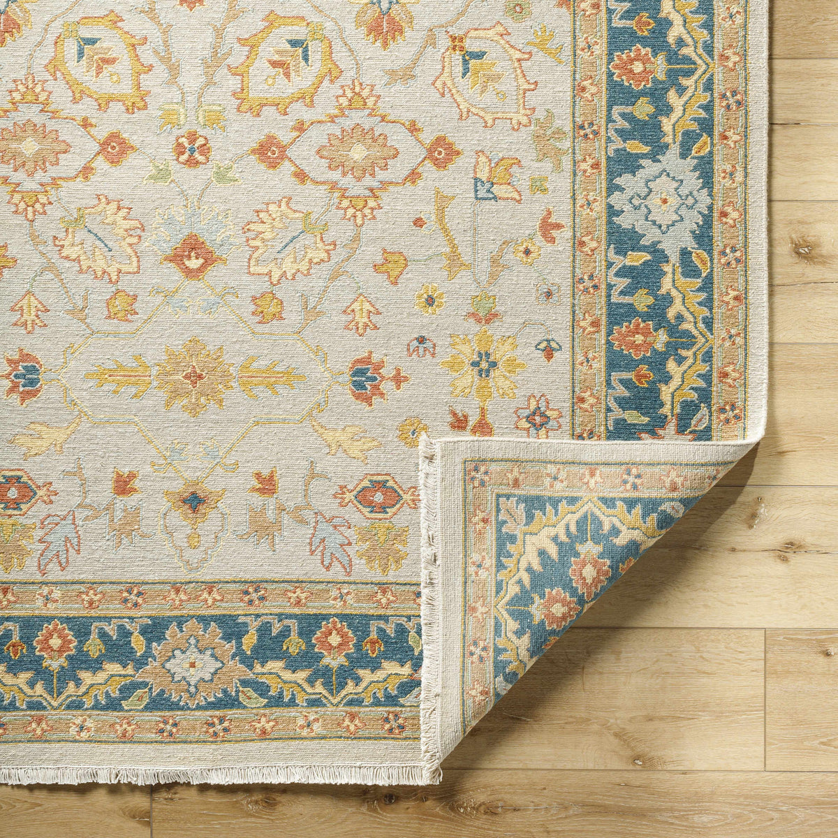 Yenimahalle Premium Rug beige field with pastel floral motif and blue border Boutique Rugs on Tampa Home & Garden Store
