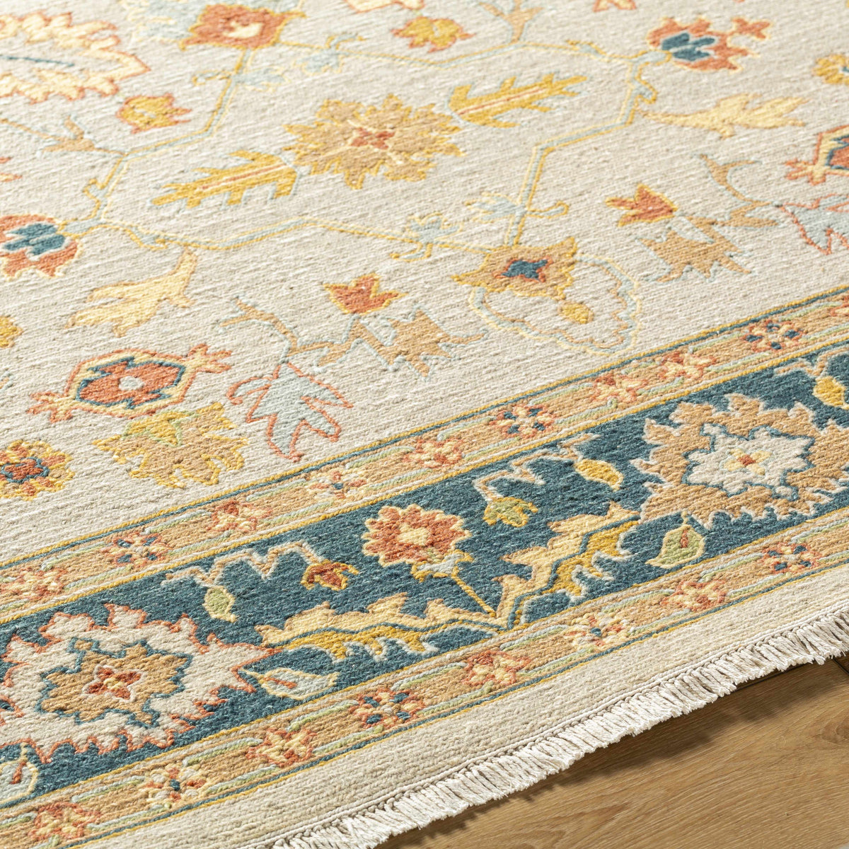 Yenimahalle Premium Rug by Boutique Rugs, cream base with pastel florals and blue border on Tampa Home & Garden Store