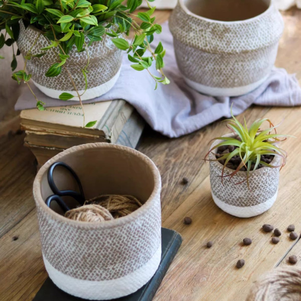 Boho straw-look planter set of 4 by RusticReach; beige woven texture with greenery on wood surface on Tampa Home & Garden Store