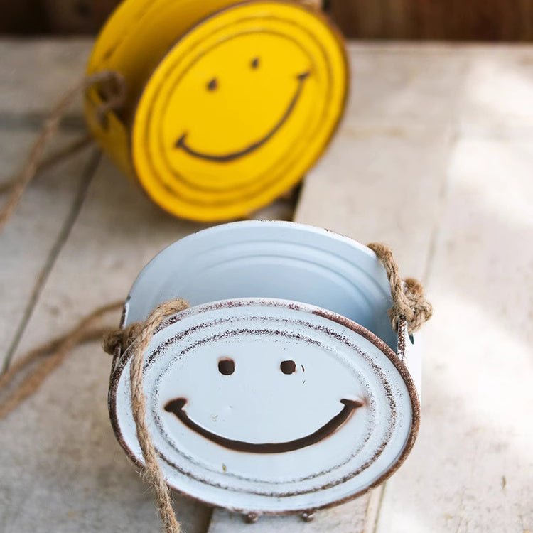 Happy Face Hanging Planter pair by RusticReach, light blue and yellow metal tins with rope handles on Tampa Home & Garden Store