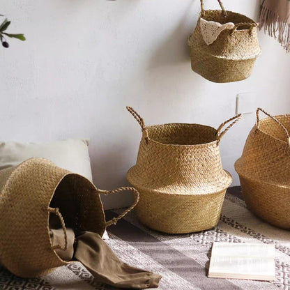 Four foldable seagrass belly baskets with handles in natural weave, styled on rug on Tampa Home & Garden Store