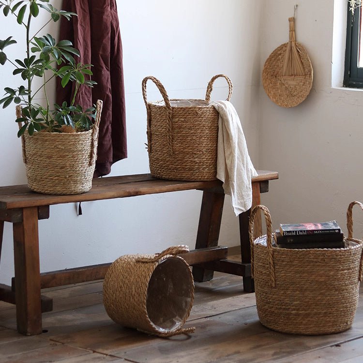 Handwoven seagrass plant baskets by RusticReach in beige with handles; set of five on bench on Tampa Home & Garden Store