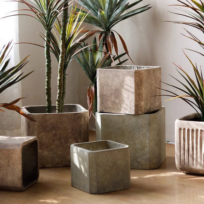 StoneGrain Square Planter set by RusticReach; gray stone-textured cubes in multiple sizes with plants on Tampa Home & Garden Store