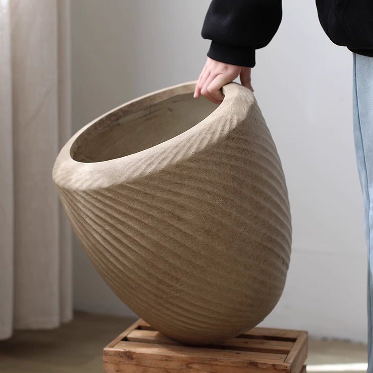 Comtemporary Swirl Planter by RusticReach, large beige ribbed planter with swirl texture on wooden stand on Tampa Home & Garden Store