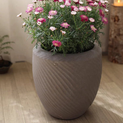 Comtemporary Swirl Planter gray ceramic pot with pink blooms by RusticReach on Tampa Home & Garden Store