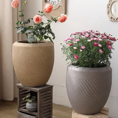 Comtemporary Swirl Planter by RusticReach - two beige and gray pots with blooming flowers on Tampa Home & Garden Store