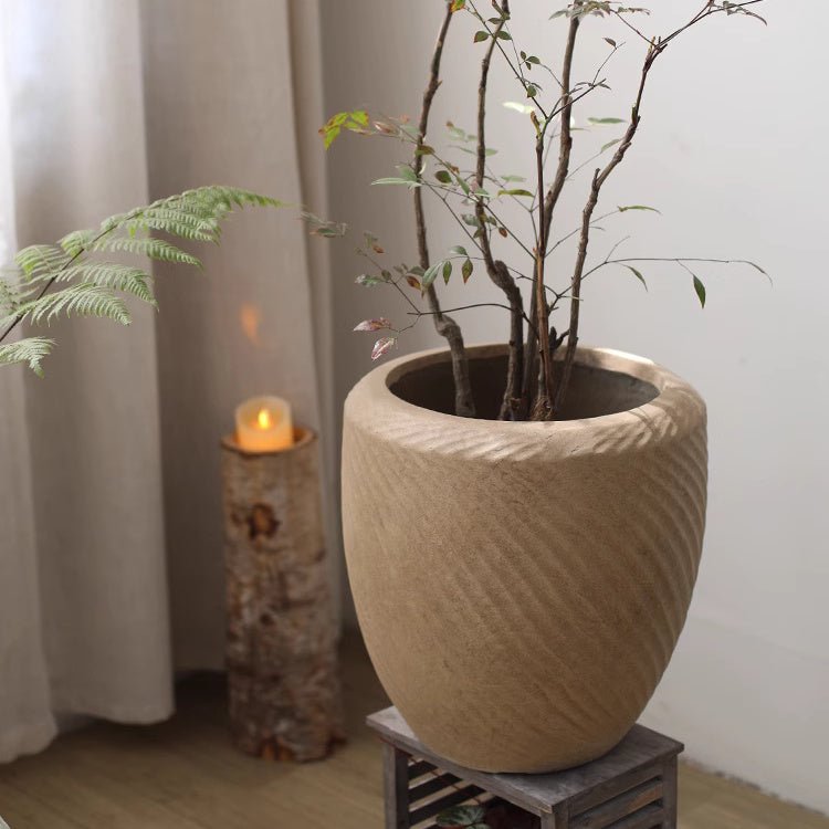 Comtemporary Swirl Planter RusticReach beige ceramic with ribbed swirl texture housing twig stems on Tampa Home & Garden Store