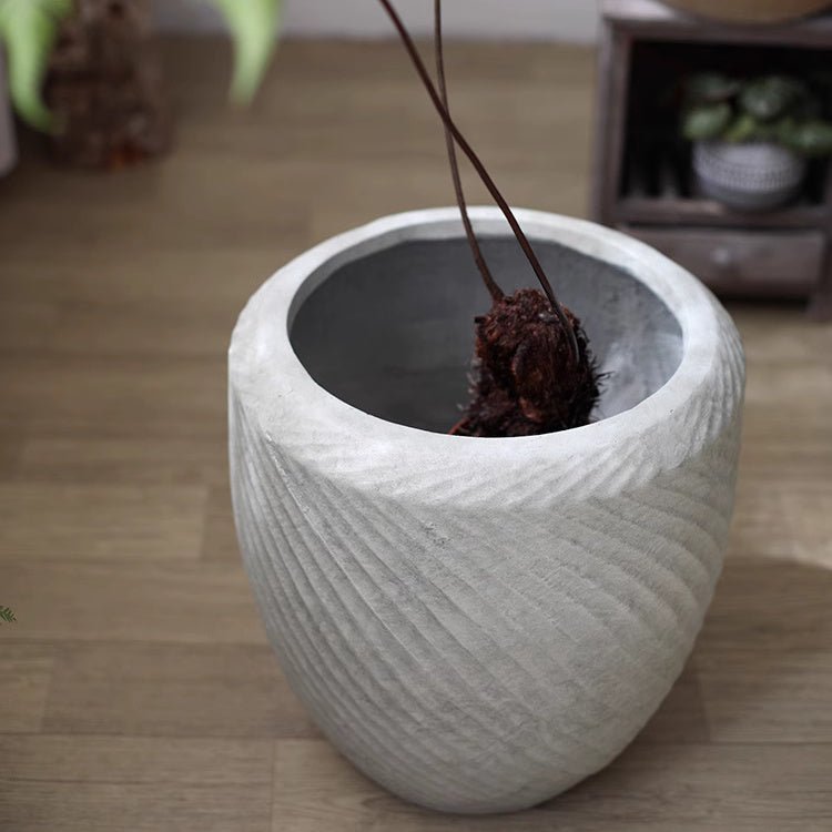 Comtemporary Swirl Planter by RusticReach; light gray concrete with spiral grooves on Tampa Home & Garden Store