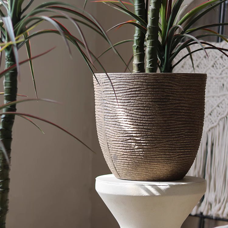 Vintage-Style Outdoor Planter by RusticReach, brown pot with tall green plant on white pedestal on Tampa Home & Garden Store