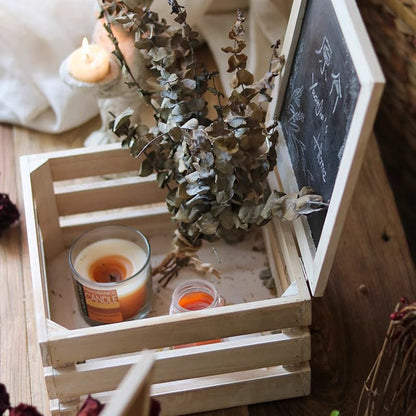 Rustic wooden crate with chalkboard lid, 2 candles and dried eucalyptus inside on Tampa Home & Garden Store