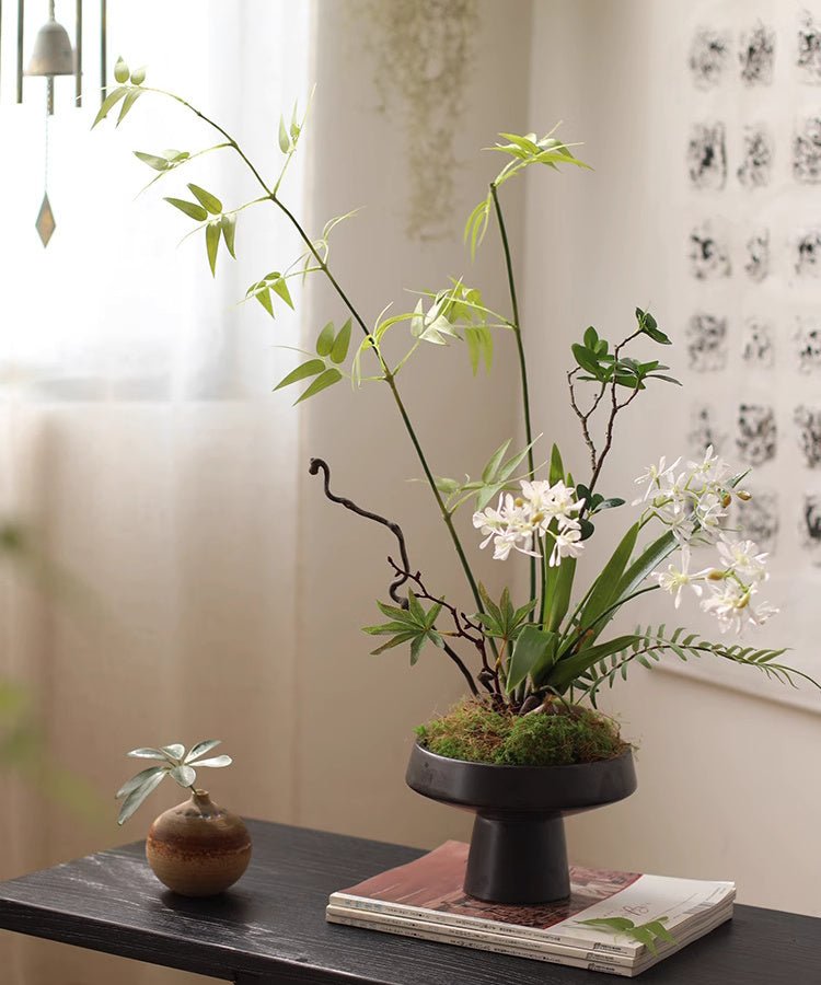 Artificial Bamboo Stem 31in tall with white blossoms in a black pedestal planter RusticReach on Tampa Home & Garden Store
