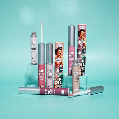 theBalm Take The High Rose Lip Oil lip gloss set in pastel pink on teal backdrop on Tampa Home & Garden Store