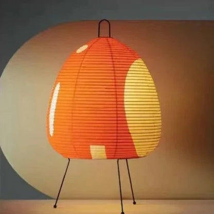 Rice Paper Floor Lamp by Moktan Sabai, orange shade with yellow panels on a slim tripod base on Tampa Home & Garden Store