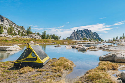 Trekker Palace 2-Person Backpacking Tent, River Country Gear, yellow and gray by lake on Tampa Home & Garden Store