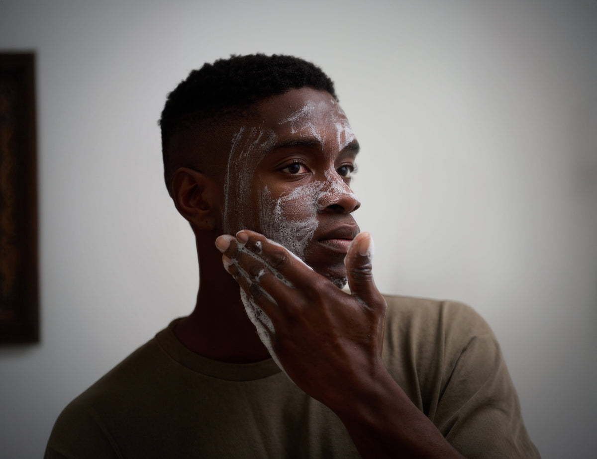 Face & Body Cleansing Bar by Bravo Sierra lathered on a person's face with foamy suds on Tampa Home & Garden Store