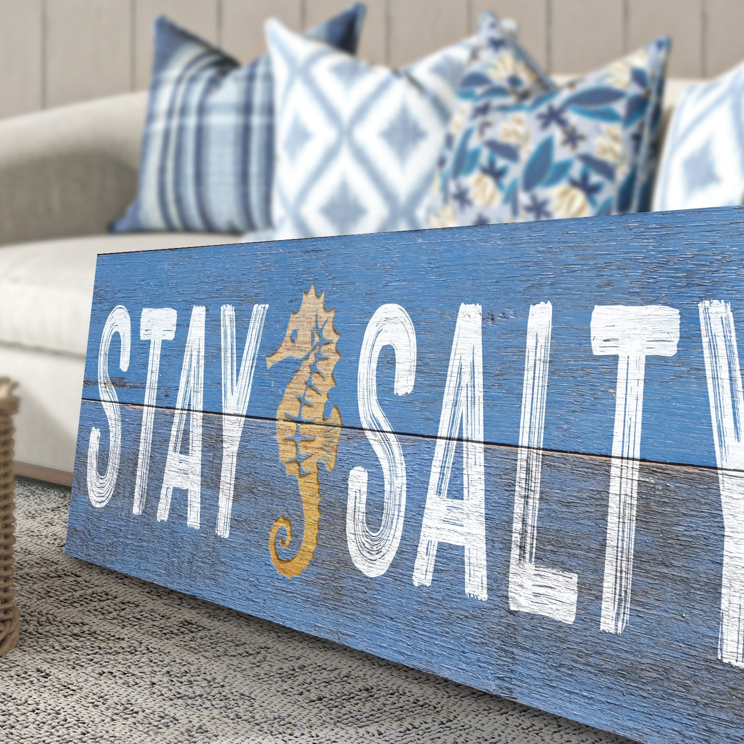 Stay Salty coastal sign on blue distressed wood with white lettering and gold seahorse on Tampa Home & Garden Store