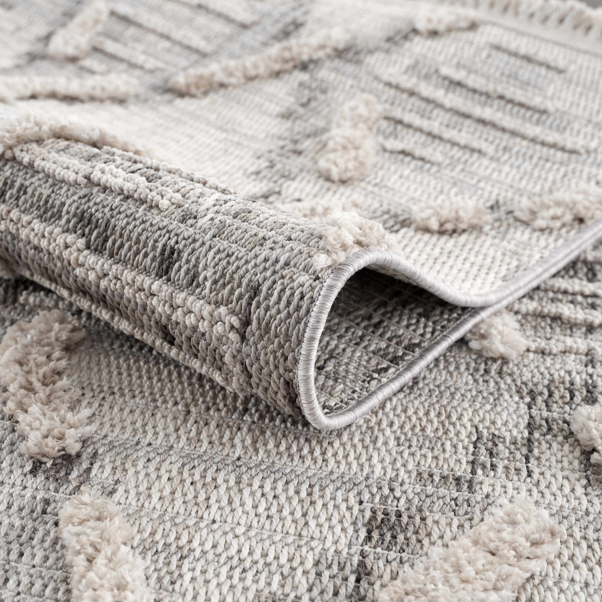 Bogtong High-Low Rustic Rug by Boutique Rugs; grey cream chunky textured pile with rolled edge on Tampa Home & Garden Store