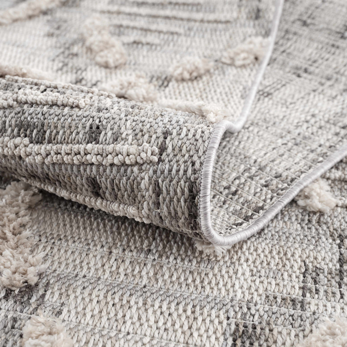 Bogtong High-Low Rustic Rug by Boutique Rugs, neutral grey beige chunky weave, stacked rugs on Tampa Home & Garden Store