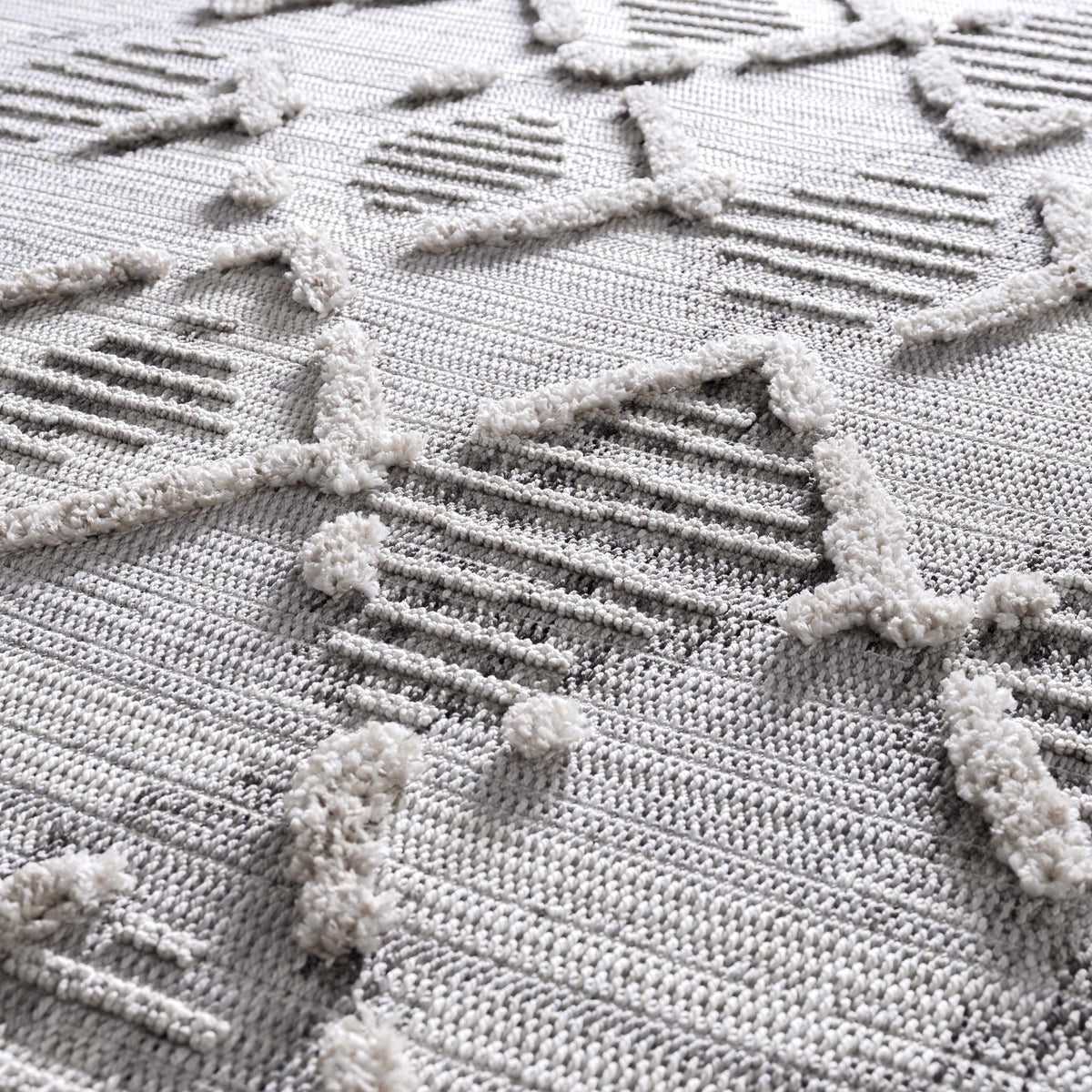 Bogtong High-Low Rustic Rug by Boutique Rugs; light gray textured rug with raised pile on Tampa Home & Garden Store