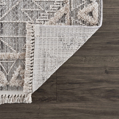 Agoo High-Low Pile Rustic Rug in grey ivory with high-low pile and fringe on wood floor on Tampa Home & Garden Store