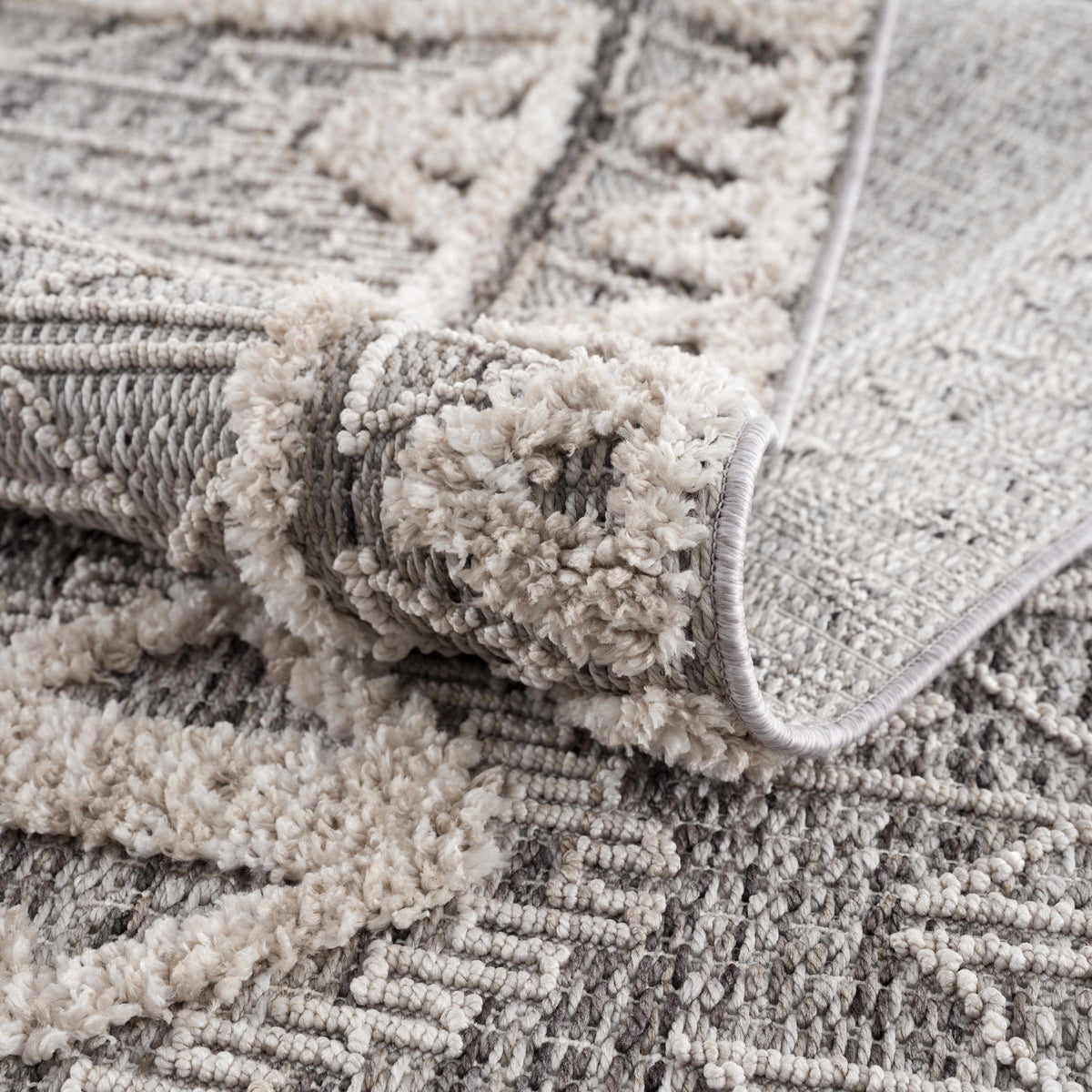 Agoo High-Low Pile Rustic Rug in neutral gray cream tones by Boutique Rugs on Tampa Home & Garden Store