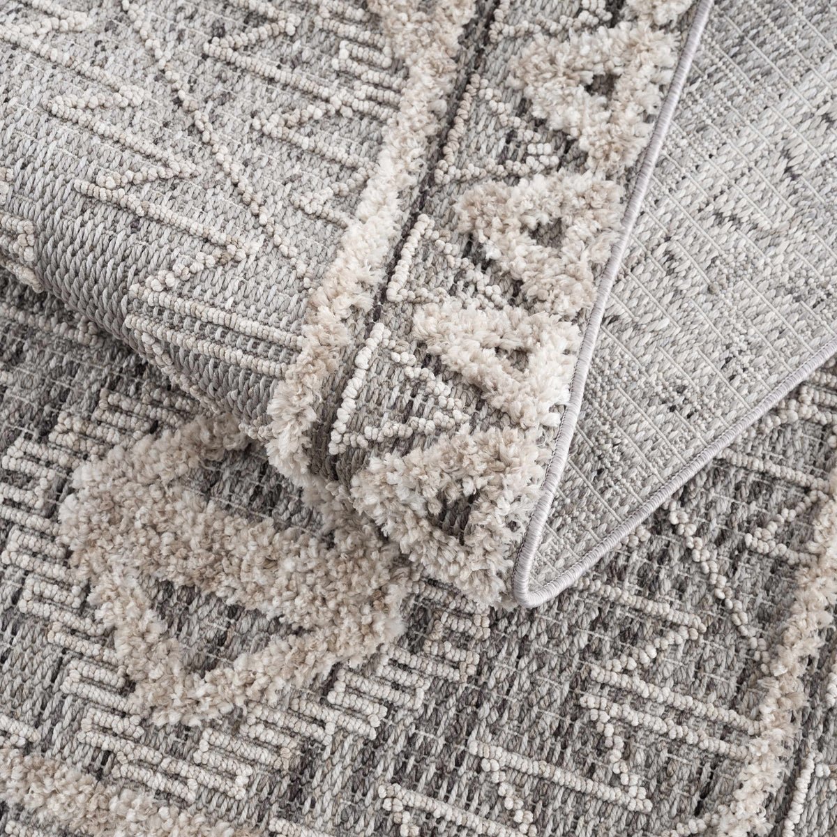 Agoo High-Low Pile Rustic Rug in gray tones with plush loops and pattern by Boutique Rugs on Tampa Home & Garden Store