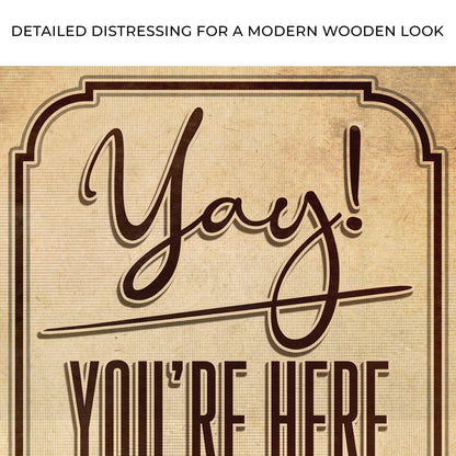 Entryway canvas sign reading Yay! You're Here by Tailored Canvases with brown script on Tampa Home & Garden Store