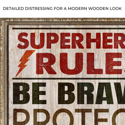 Canvas sign Tailored Canvases distressed wood frame with bold red SUPERHERO RULES lettering on Tampa Home & Garden Store
