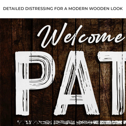 Welcome To The Patio Sign by Tailored Canvases with white script on dark wood background on Tampa Home & Garden Store