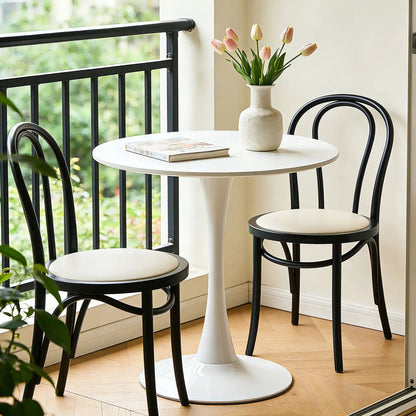Round Dining Table With Tulip Style Base white pedestal; black bentwood chairs; pink tulip vase on Tampa Home & Garden Store