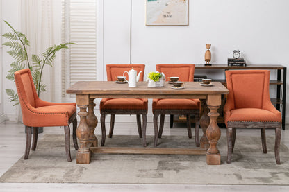 Ultra Side Dining Chair, Nail Head orange upholstery with dark wood legs at a wood dining table on Tampa Home & Garden Store