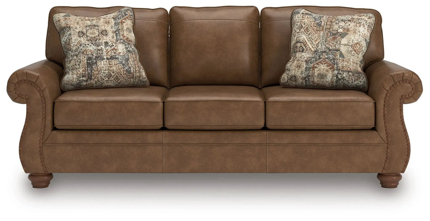 Chasemore Sofa brown leather stationary sofa with 2 decorative patterned pillows Unique Piece Furniture on Tampa Home & Garden Store
