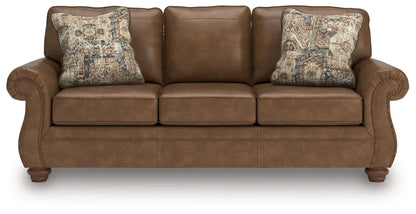 Chasemore Sofa brown leather stationary sofa with 2 decorative patterned pillows Unique Piece Furniture on Tampa Home & Garden Store
