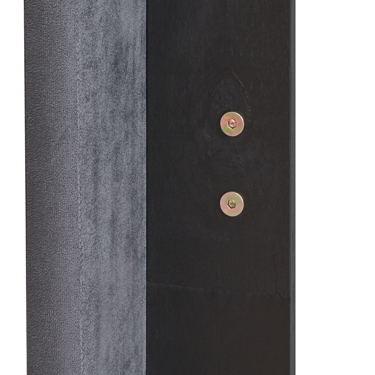Queen platform bed panel in gray upholstery beside black wood with visible brass bolts on Tampa Home & Garden Store