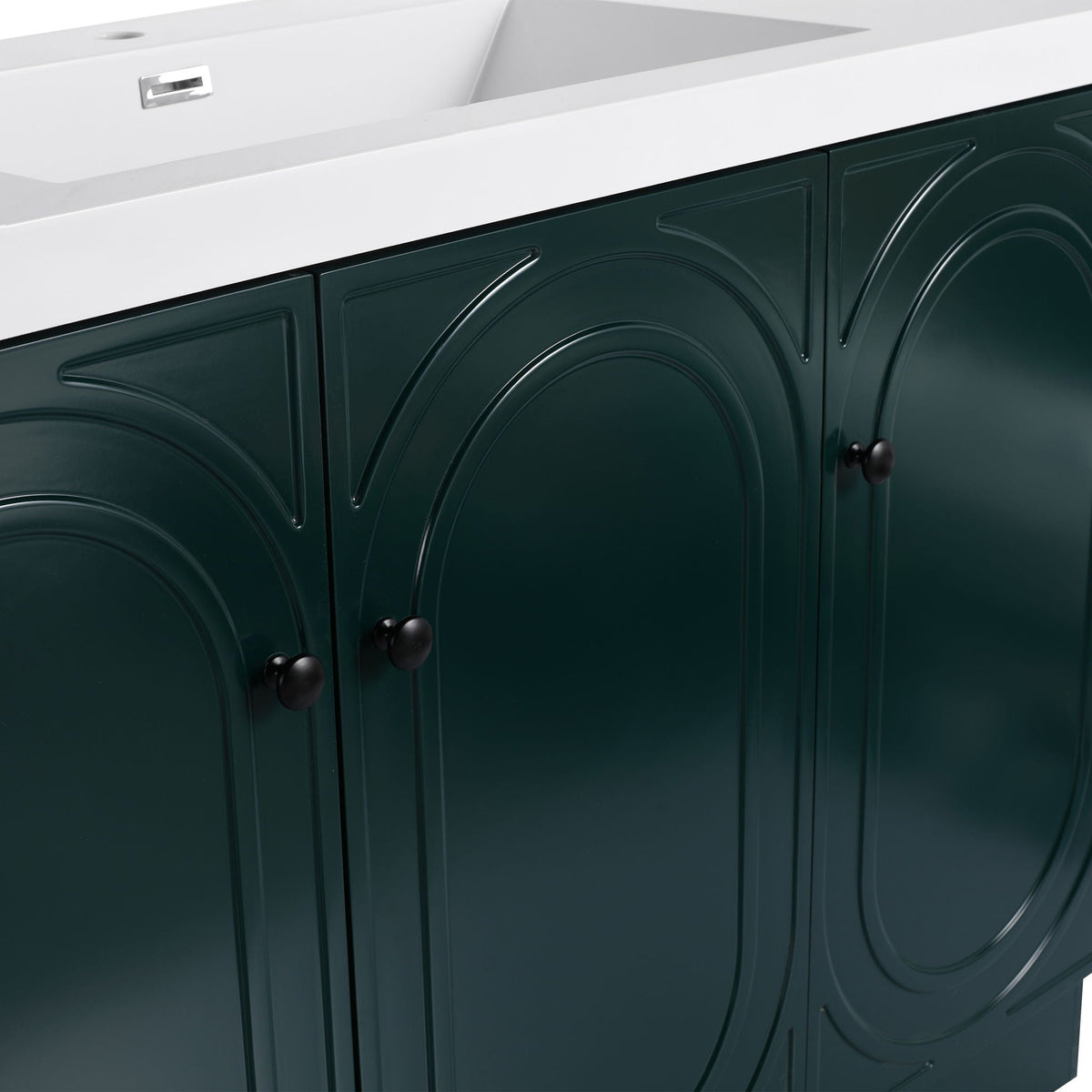 Freestanding bathroom vanity with soft-close doors in deep green finish, white countertop, black knobs on Tampa Home & Garden Store
