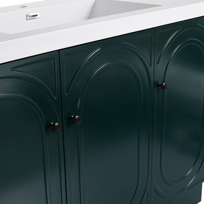 Freestanding bathroom vanity with soft-close doors in deep green finish, white countertop, black knobs on Tampa Home & Garden Store