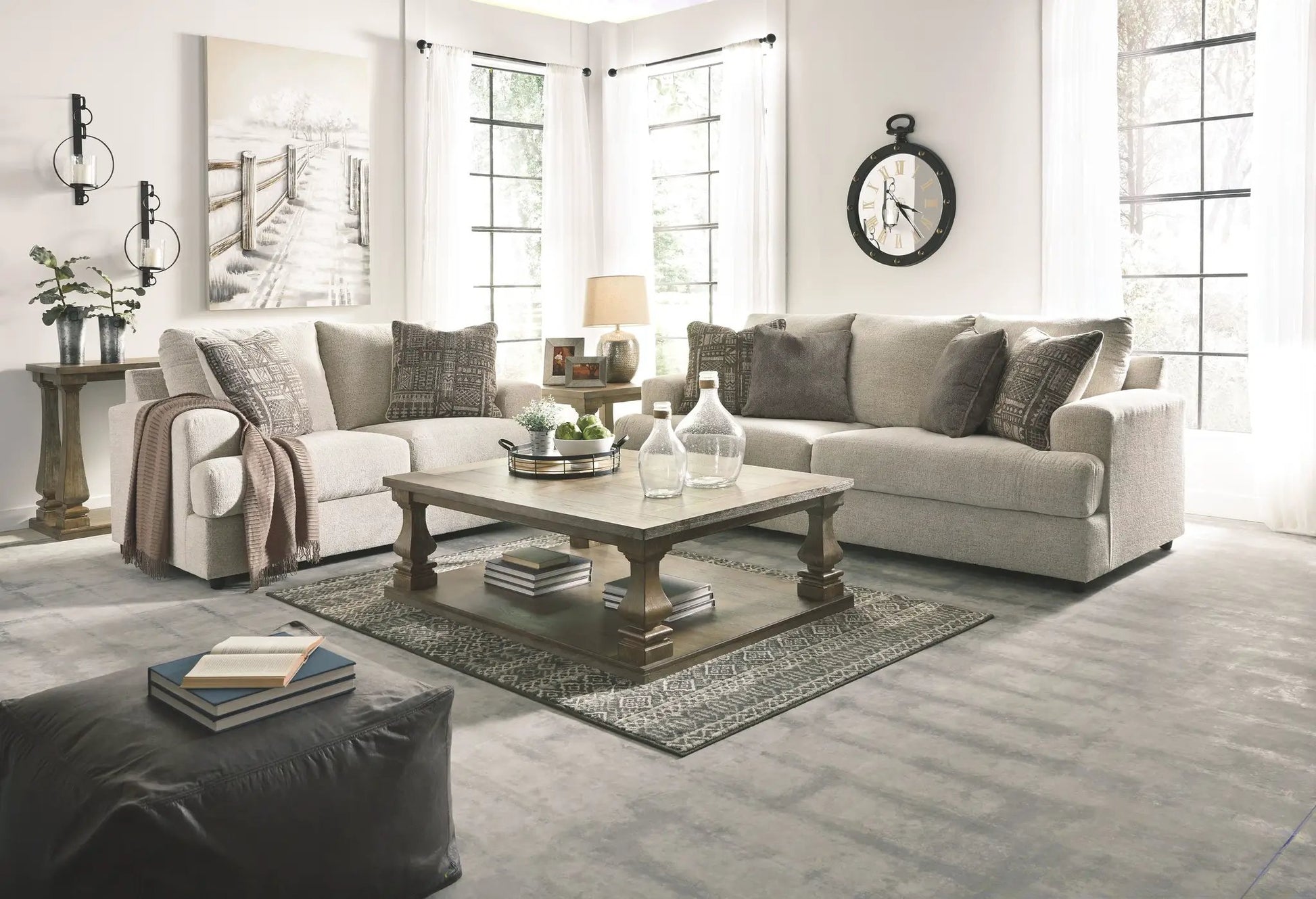 Soletren Sleeper Sofa in gray fabric with neutral pillows in a bright living room on Tampa Home & Garden Store