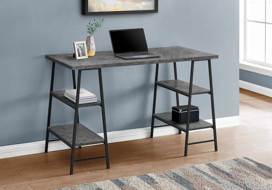 Computer desk with stone top and black metal frame; laptop, plant, and photo frame on top on Tampa Home & Garden Store