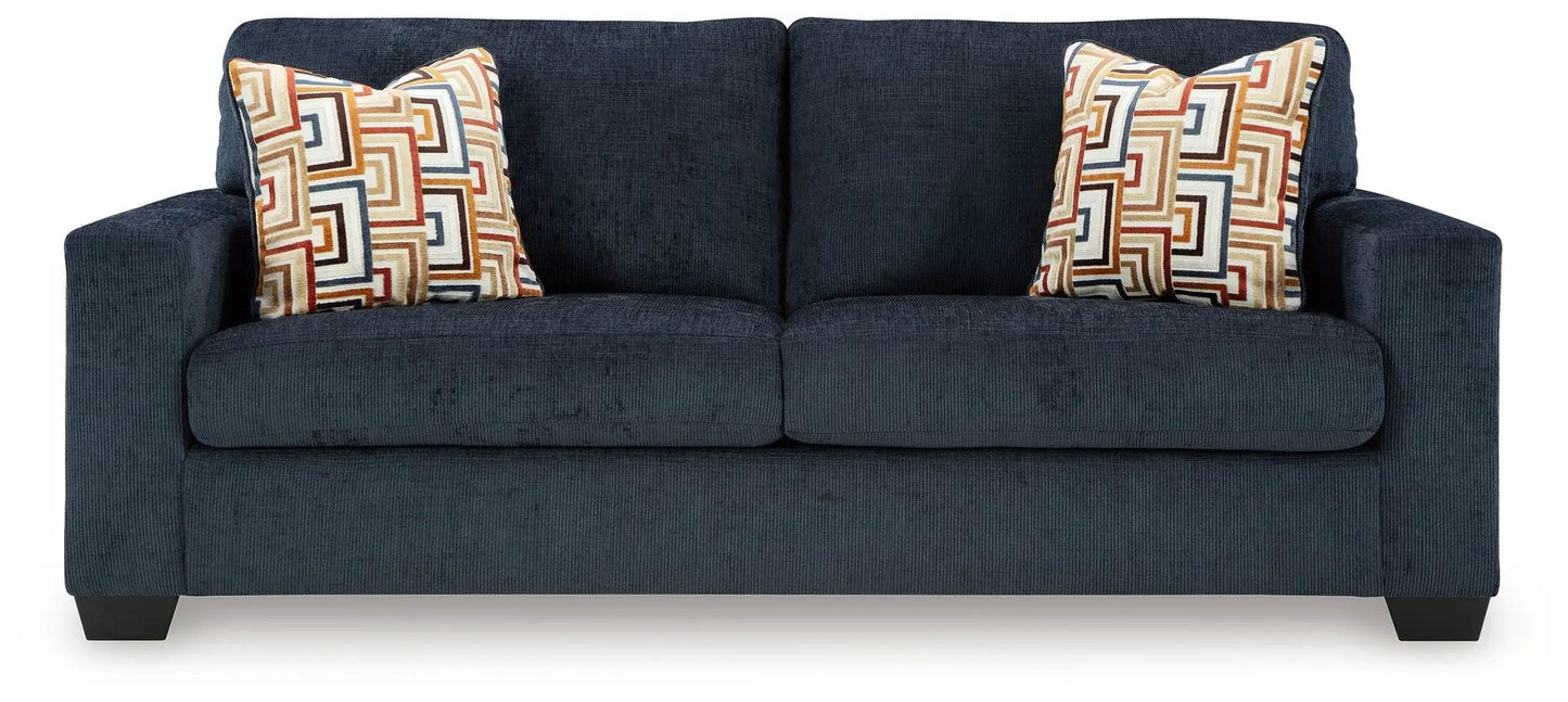 Aviemore sofa by Unique Piece Furniture, navy stationary sofa with two geometric pillows on Tampa Home & Garden Store