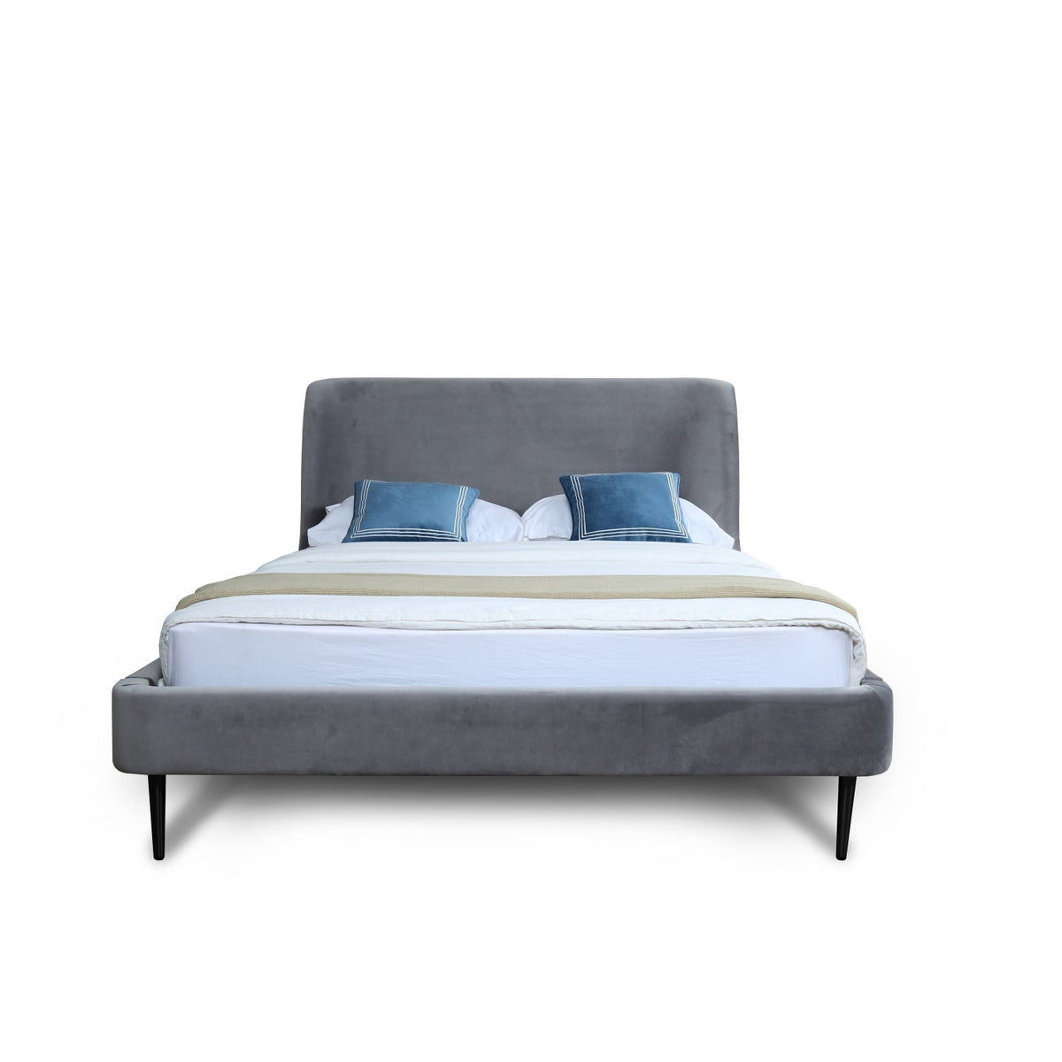 Heather upholstered bed with curved grey headboard and matching footboard, blue pillows on Tampa Home & Garden Store