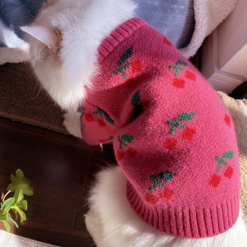 Bowknot pink knit dog sweater with red cherries and green leaves by Pet Zen, hollow knit design on Tampa Home & Garden Store