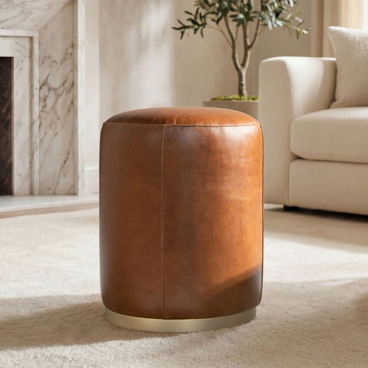 Brown leather round ottoman with brass base, storage ottoman for living spaces on Tampa Home & Garden Store