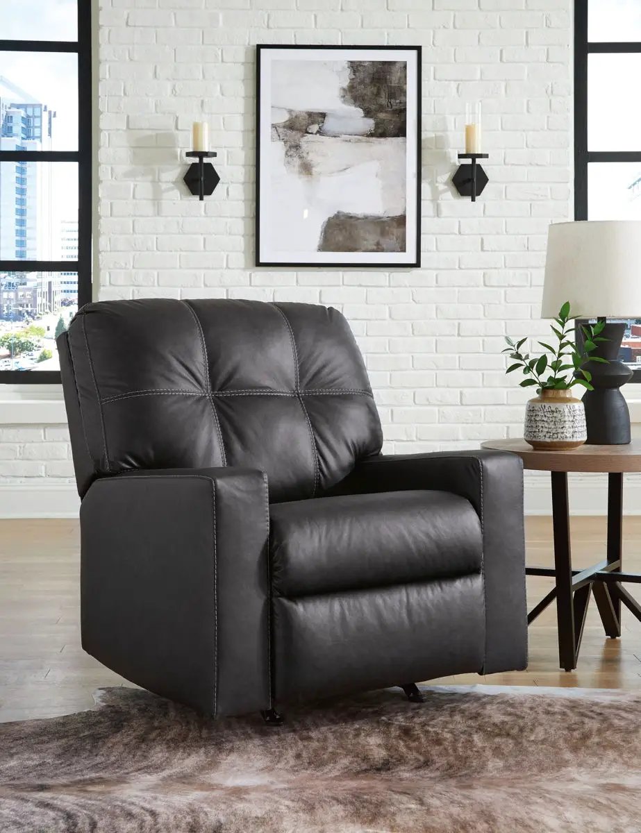 Barlin Mills rocker recliner in dark gray leather with tufted back in a modern living room on Tampa Home & Garden Store