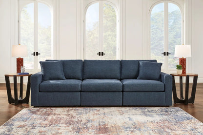 Modmax Sectional Ink navy blue fabric sofa with cushions in a bright living room on Tampa Home & Garden Store