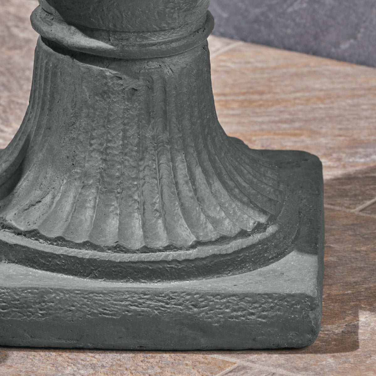 MGO Garden Urn Planter by HouseOfZazla, dark charcoal stone urn with fluted base on wood surface on Tampa Home & Garden Store