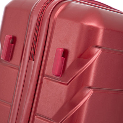 Red hard-shell luggage close-up with zipper detailing and side latches on Tampa Home & Garden Store