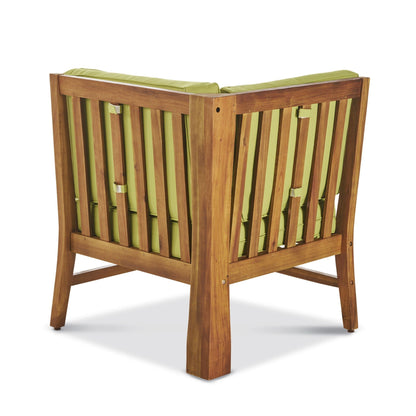 Perla Corner Chair with water-resistant green cushions in a warm wooden frame on Tampa Home & Garden Store